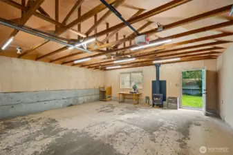 The oversized 2+ car garage is perfect as a studio for woodworking or your favorite hobbies. Stay super warm all year long with the newly installed wood stove.