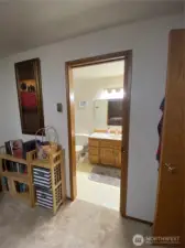 From primary, looking into main full bath w pocket door