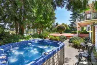 Private hot tub in corner of front yard