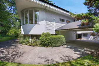 Back of property with wrap around windows and enormous carport. All new roofing