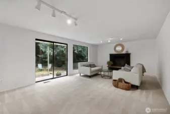 Second living room on the main floor with fireplace.