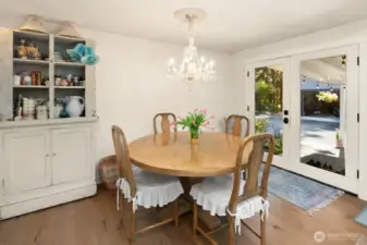 Dining room with French doors to DADU and big backyard.
