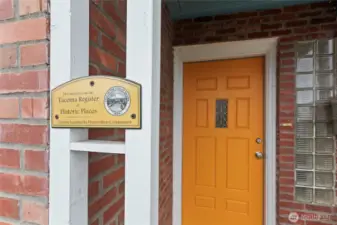 A freshly painted front door for a pop of color and vintage glass bricks