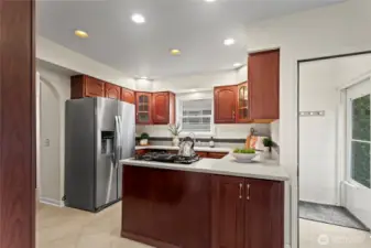 A well-thought out kitchen with stainless steel appliances and an inset gas range