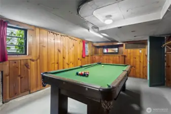 A lounge/bonus room in the basement with a bar and vintage pool table (built in Tacoma!)