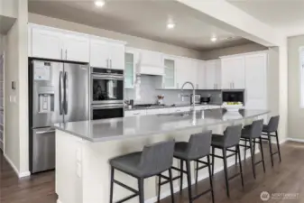 Oversized kitchen island, looking out over living space. Entertainers dream!