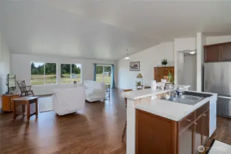 Enter to vaulted ceilings and durable LVP flooring.