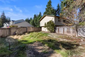 Large lot, mostly fenced in.