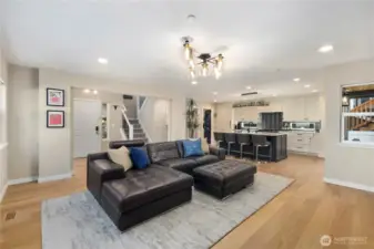 Open space living area with fireplace.