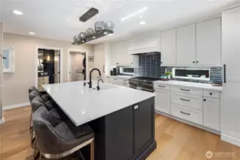 Kitchen with quartz counters, custom soft-close cabitenary, stainless steel appliances and much more.