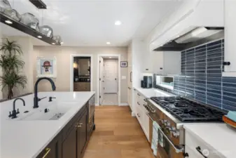 Kitchen with quartz counters, custom soft-close cabitenary, stainless steel appliances and much more.