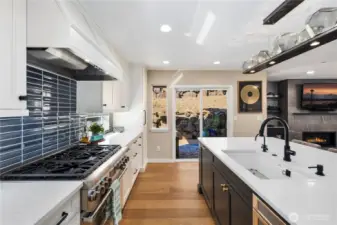 Kitchen with quartz counters, custom soft-close cabitenary, stainless steel appliances and much more.