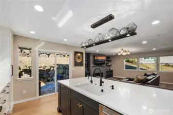 Kitchen with quartz counters, custom soft-close cabitenary, stainless steel appliances and much more.