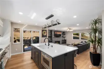 Kitchen with quartz counters, custom soft-close cabitenary, stainless steel appliances and much more.