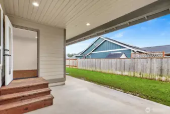 Can you go wrong with a covered patio in the Pacific Northwest? It offers shade from the sun, protection from the rain, and the perfect spot to BBQ a steak dinner year-round.