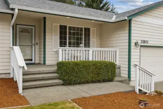 Comfortable, welcoming, covered front porch to enjoy coffee and a visit.