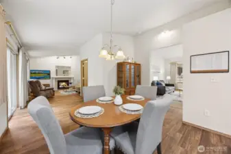 View from the kitchen, past the dining area, into the family room.