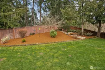 Lovely outdoor space features dry river bed