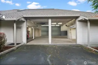 Large double garage doors for the shop. Current owners are using this area as a home gym and boat storage.