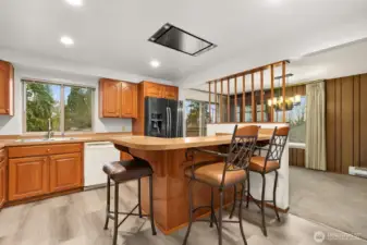 Kitchen with bar-height counter is a great place for a quick meal.