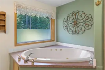 Soak tub in primary bedroom