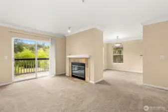 Fresh carpets throughout and cozy gas fireplace create a warm, inviting space.