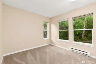 Second bedroom is bright & airy. Also, sits at back of condo with tranquil views.