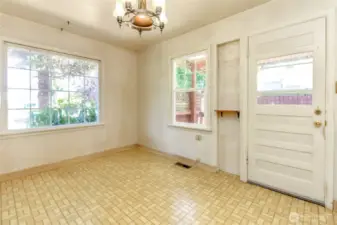 Spacious dining area with large windows.