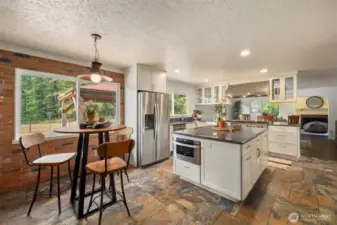 The breakfast area is just off the oversized walk-in pantry and provides access to the back stairway.
