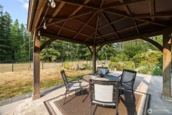 Whether you're sipping coffee under the covered front porch, strolling the woodland trails, or expanding your garden oasis, this is true serenity—complete with wildlife, clean air, and a backdrop of Cascade foothills. Just minutes from Bellingham, yet a world away.