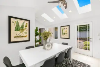 Vaulted Ceilings and Skylights Give the Room a Spacious Feeling.