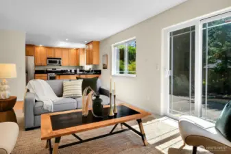 These sliding doors bring in more light and flow right out to the back yard patio, which is plumbed for your gas grill!