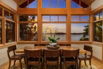 Soaring breakfast nook with wall of windows brining the lake views in!