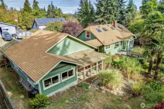 Back of garage/main house - music room/workshop on left and green house on right