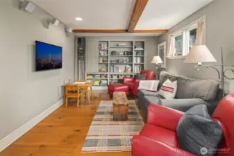 Den, family room, or office... how will you use it? A half bath adjoins this room, with space and plumbing for a shower if needed.