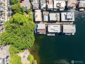 Drone view from above! Floating home is on the end, surrounded by water.