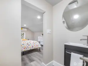 A view from the half bathroom looking into bedroom 3