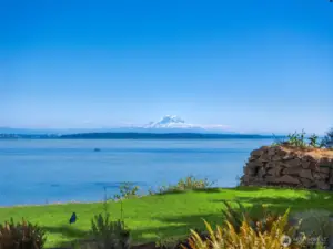 An ever-changing panorama - calm blue waters stretching toward the Cascades, with Mt. Rainier rising in the distance. A view that feels expansive, peaceful, and distinctly Pacific Northwest.