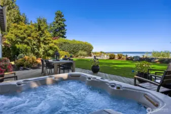 Private backyard oasis with a hot tub, fire pit and expansive views.