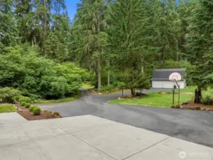 This is a great view of the front of the property, including the detached garage/shop/outbuilding