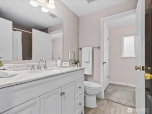 Large vanity in the updated, primary bathroom.