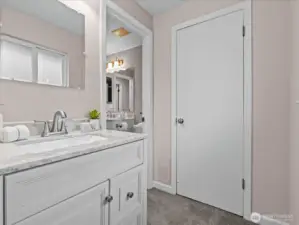 A separate vanity area is located between the primary bedroom and primary bath.