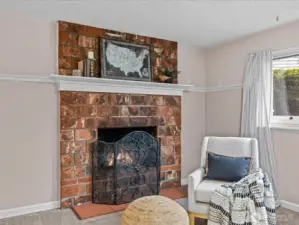 Anchoring the lrec room, the wood-burning ffireplace promises cozy nights ahead.