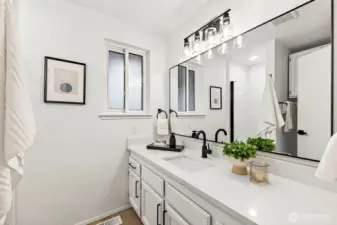 A well-sized fourth bedroom with LVP flooring, a large window with treetop views, and a neutral finish ready for any use.