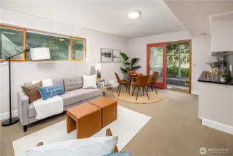 The garden level family room opens through French doors to a lush and welcoming backyard, creating a relaxed gathering space that extends naturally into the landscape.