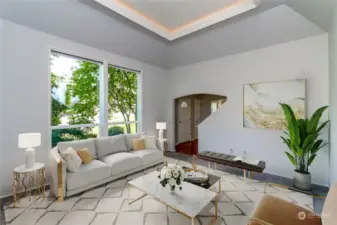 Adjacent to the foyer is a lovely formal living room, a great conversation room. This photo has been virtually staged.