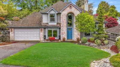 This home is surrounded by colorful landscape meticulously maintained. Pride in ownership here.