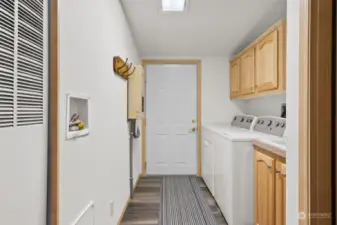 Laundry room with washer/dryer and door to the 2 car garage