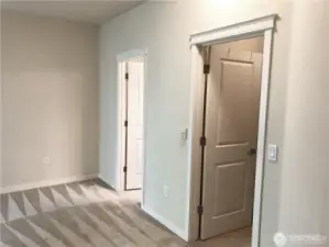 Primary bedroom features French doors, walk-in closet, and ensuite full bathroom.