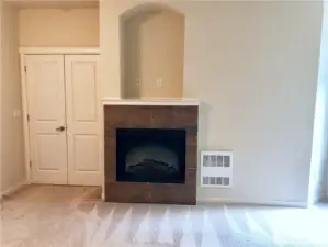 Primary bedroom looking towards French doors and gas fireplace.